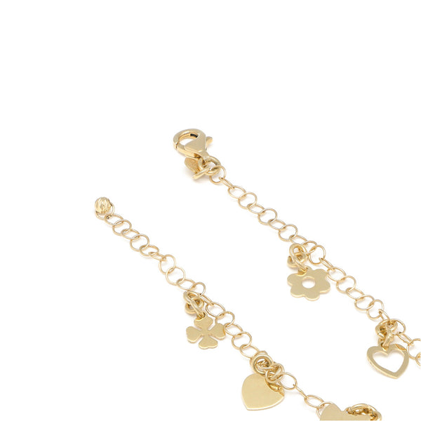 Pulsera eslabón cruzado con colgantes motivo diversas figura en oro amarillo 14 kilates.