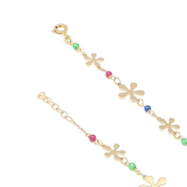 Pulsera eslabón cruzado con aplicaciones de flores y sintéticos en oro amarillo 14 kilates.