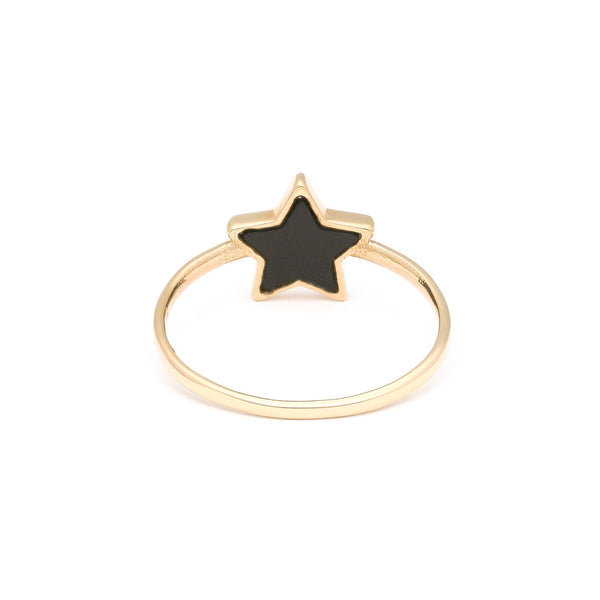 Anillo liso motivo estrella con sintético en oro amarillo 14 kilates.