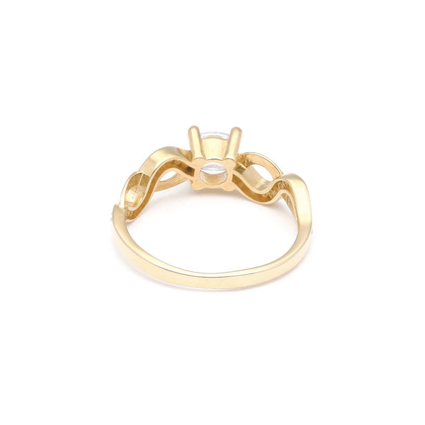 Anillo de compromiso con circonias en oro amarillo 14 kilates.