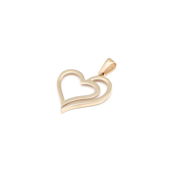 Dije liso motivo corazón en oro amarillo 14 kilates.