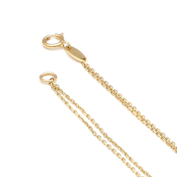 Pulsera de dos hilos eslabón cruzado con aplicaciones motivo estrellas en oro amarillo 14 kilates.