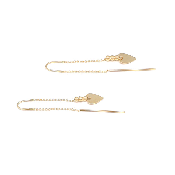Aretes diseño especial con colgantes motivo corazón en oro amarillo 14 kilates.