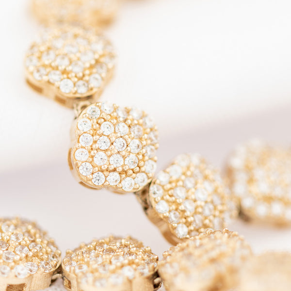 Collar eslabón articulado con circonias motivo flor en oro amarillo 14 kilates.