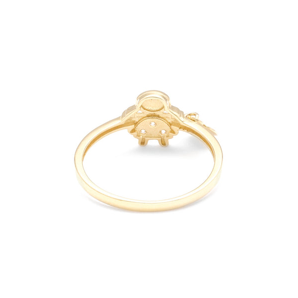 Anillo diseño especial motivo niña y corazón con circonias en oro amarillo 14 kilates.