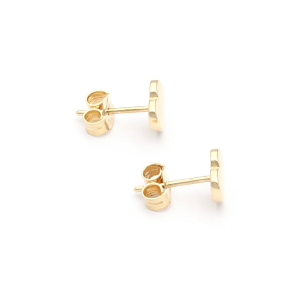 Aretes lisos motivo corazón en oro amarillo 14 kilates.