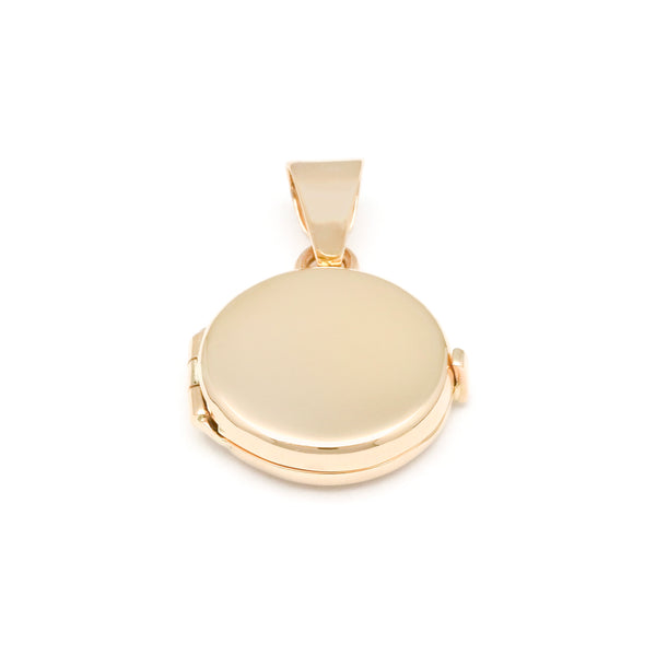 Dije guardapelo liso en oro amarillo 14 kilates.