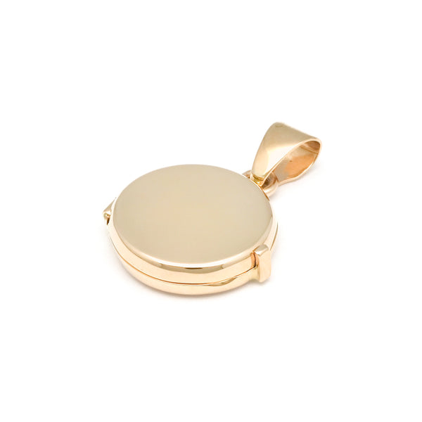 Dije guardapelo liso en oro amarillo 14 kilates.