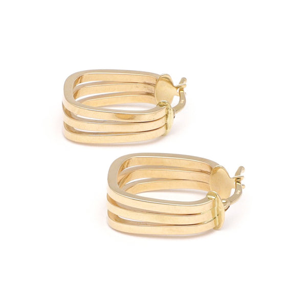 Arracadas triples lisas en oro amarillo 14 kilates.