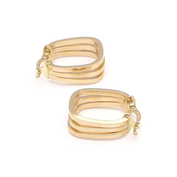 Arracadas triples lisas en oro amarillo 14 kilates.