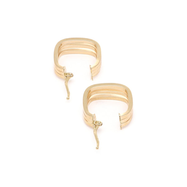 Arracadas triples lisas en oro amarillo 14 kilates.