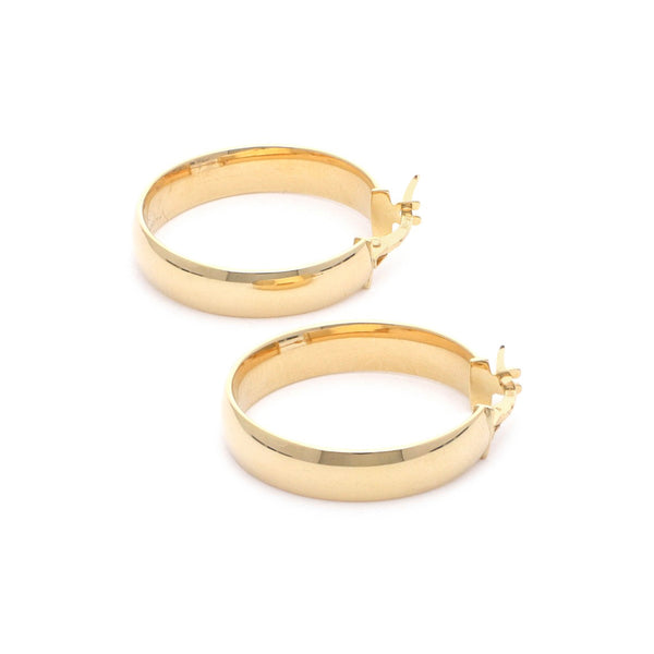 Arracadas lisas en oro amarillo 14 kilates.
