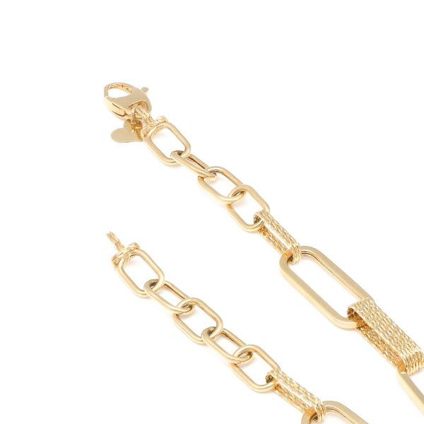 Pulsera eslabón cruzado en oro amarillo 14 kilates.