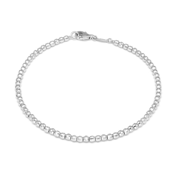 Pulsera eslabón boleado en oro blanco 14 kilates.
