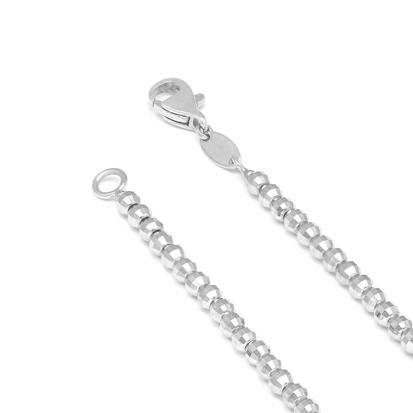Pulsera eslabón boleado en oro blanco 14 kilates.