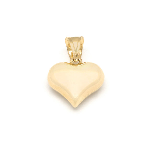 Dije hueco motivo corazón en oro amarillo 14 kilates.