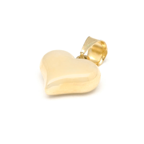 Dije hueco motivo corazón en oro amarillo 14 kilates.