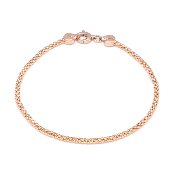 Pulsera eslabón tejido en oro rosa 14 kilates.