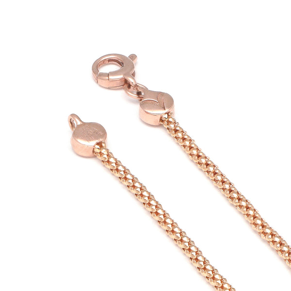 Pulsera eslabón tejido en oro rosa 14 kilates.