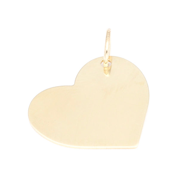 Dije liso motivo corazón en oro amarillo 14 kilates.