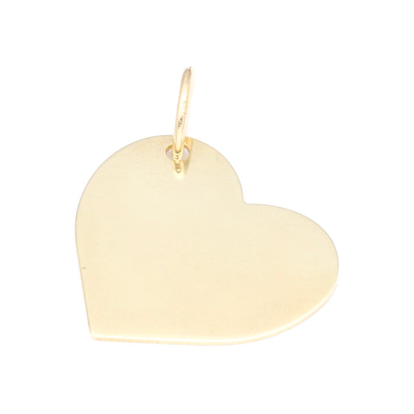 Dije liso motivo corazón en oro amarillo 14 kilates.
