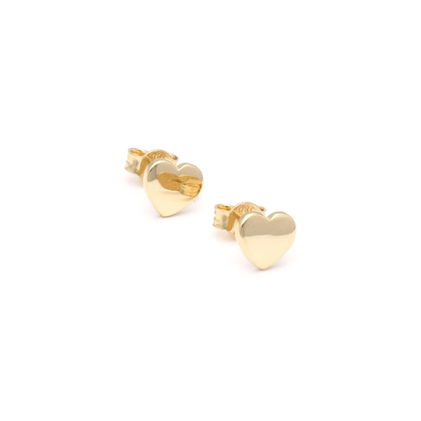 Aretes lisos motivo corazón en oro amarillo 14 kilates.