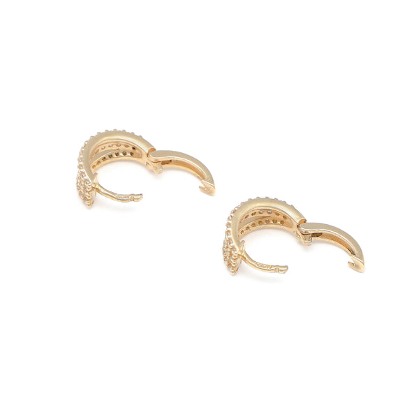 Arracadas diseño especial con circonias en oro amarillo 14 kilates.