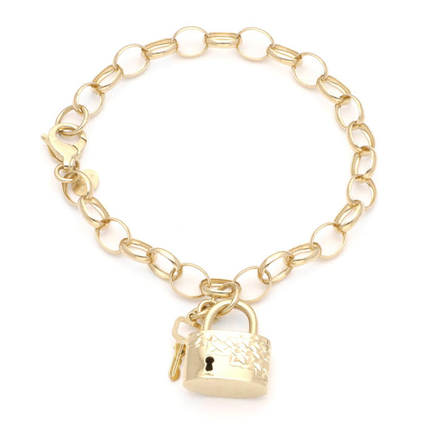 Pulsera eslabón cruzado con colgantes motivo candado y llave en oro amarillo 14 kilates.