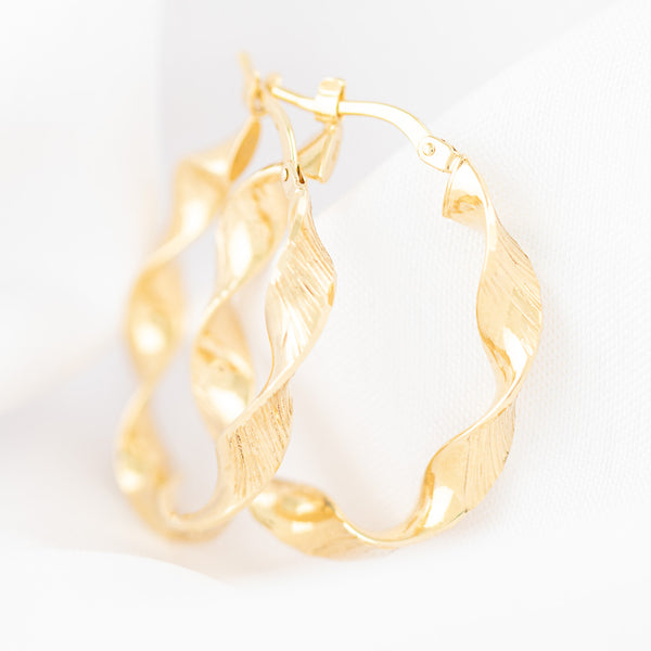 Arracadas torzal en oro amarillo 14 kilates.