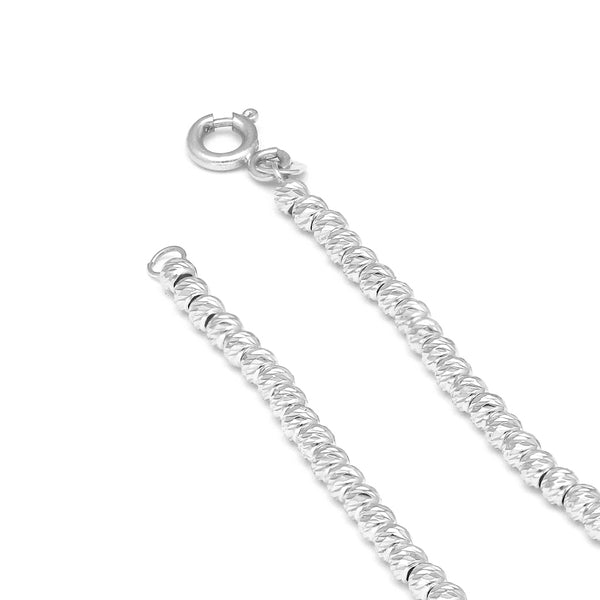 Pulsera eslabón boleado en oro blanco 14 kilates.