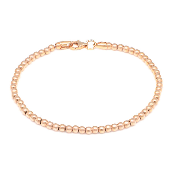 Pulsera eslabón boleado en oro rosa 14 kilates.