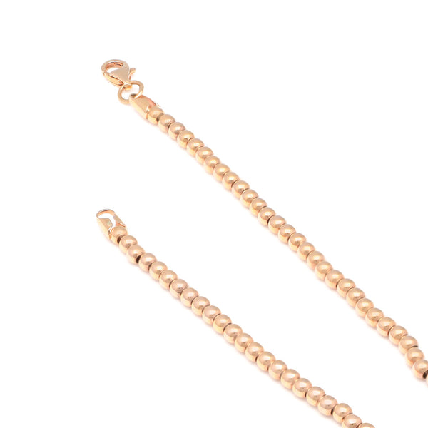 Pulsera eslabón boleado en oro rosa 14 kilates.