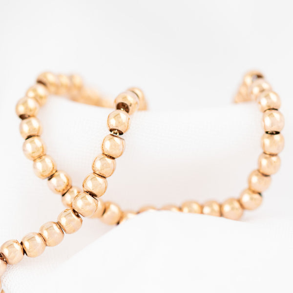 Pulsera eslabón boleado en oro rosa 14 kilates.