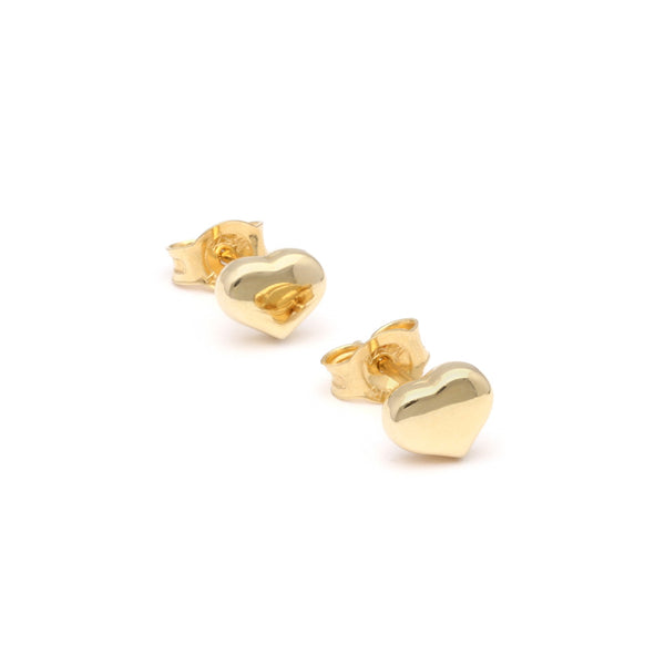 Arete liso motivo corazón en oro amarillo 14 kilates.