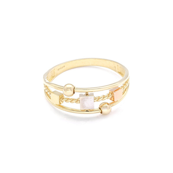 Anillo estilizado en oro tres tonos 14 kilates.