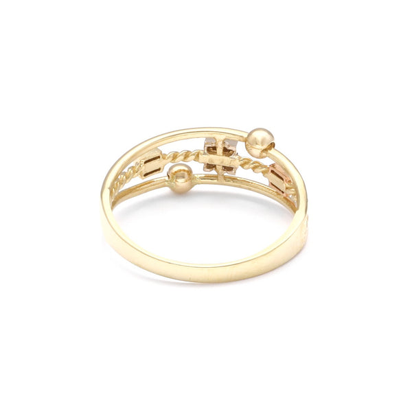 Anillo estilizado en oro tres tonos 14 kilates.