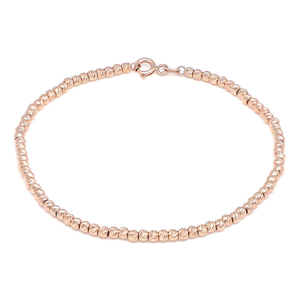 Pulsera eslabón boleado en oro rosa 14 kilates.