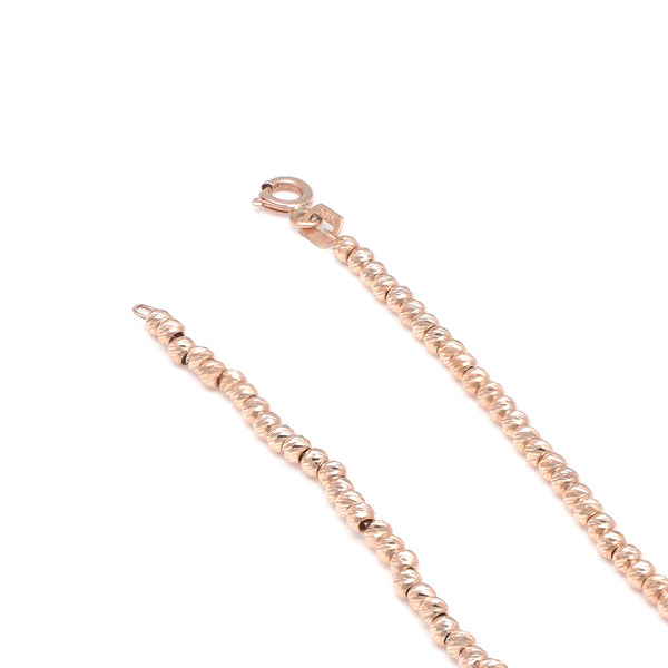 Pulsera eslabón boleado en oro rosa 14 kilates.