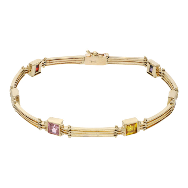 Pulsera eslabón articulado con aplicaciones de sintéticos en oro amarillo 14 kilates.