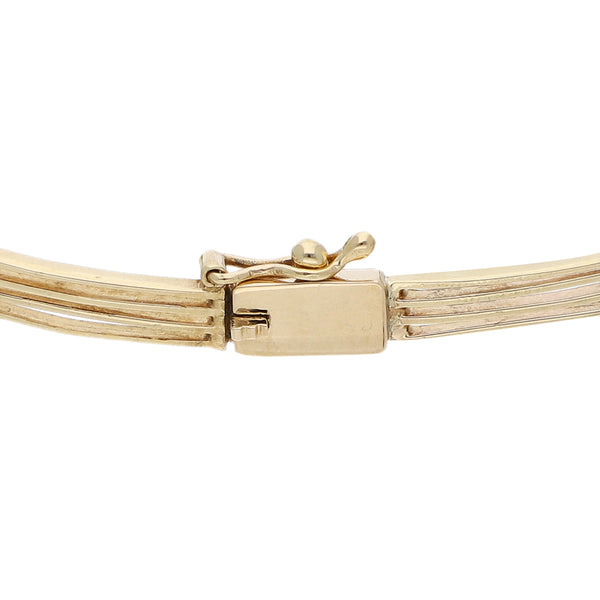 Pulsera eslabón articulado con aplicaciones de sintéticos en oro amarillo 14 kilates.
