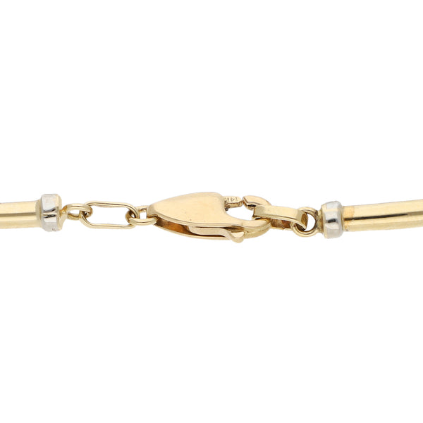 Pulsera eslabón combinado en oro amarillo 14 kilates.