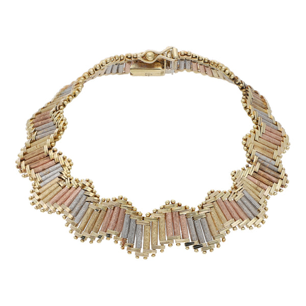 Pulsera eslabón boleado en oro tres tonos 14 kilates.