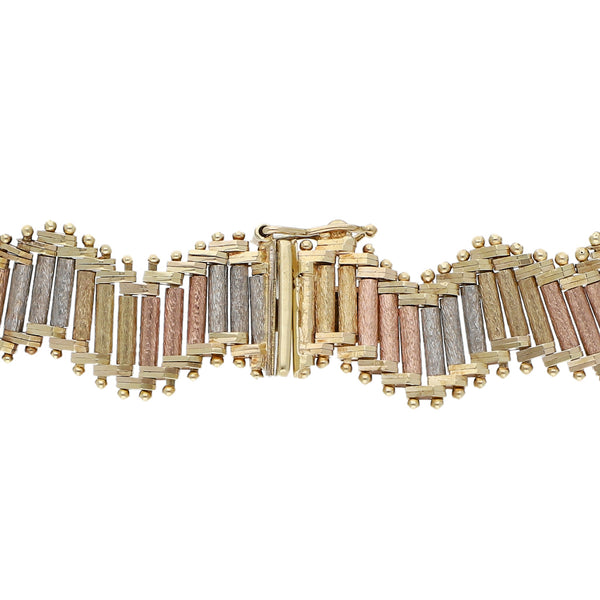 Pulsera eslabón boleado en oro tres tonos 14 kilates.