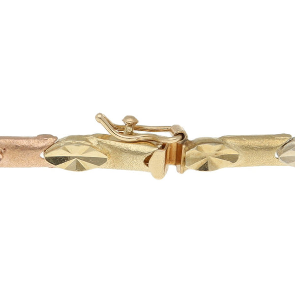 Pulsera eslabón articulado en oro tres tonos 14 kilates.