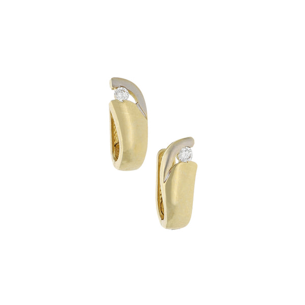 Arracadas articuladas con circonia en oro amarillo 14 kilates.
