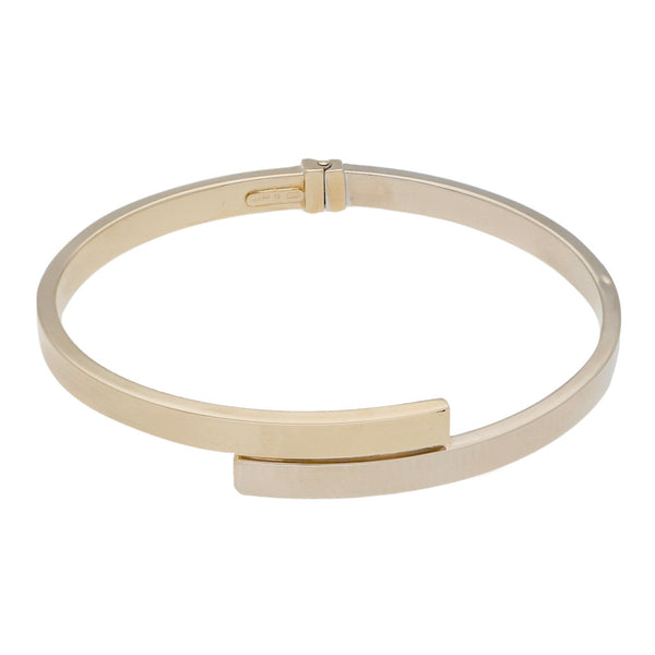 Pulsera de arillo articulada en oro dos tonos 14 kilates.