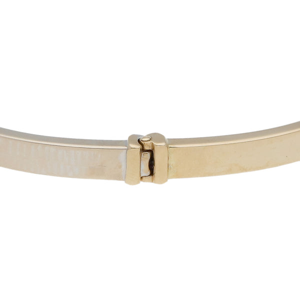 Pulsera de arillo articulada en oro dos tonos 14 kilates.