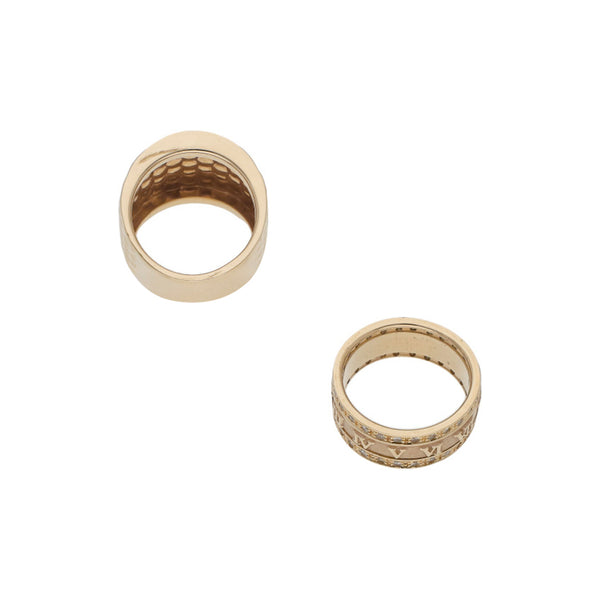 Anillo laminado y argolla giratoria con sintéticos en oro amarillo 14 kilates.