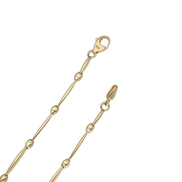 Juego de gargantilla, pulsera eslabón articulado, anillo y broqueles diseño especial con sintéticos en oro dos tonos 14 kilates.