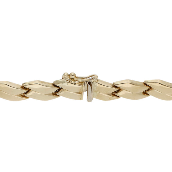 Pulsera eslabón articulado en oro amarillo 14 kilates.